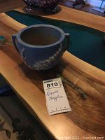 Single blue Roseville Foxglove patterned bowl or planter on wooden surface with lot tag.