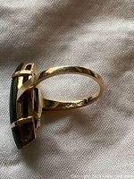 Side profile of ring showing 10K gold stamp on the band and open prong setting