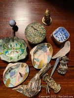 Top-down view of the entire lot showing all 10 items arranged together on a wooden surface.
