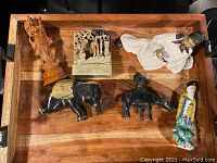 Top view of the wooden tray displaying all six antique Oriental items including bronze, ceramic, wood, and stone pieces.