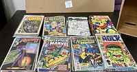 Top layer of eight bagged single issues laid out