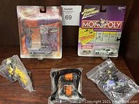 Five collectible vehicles including two Johnny Lightning die-cast cars, and three sealed kids meal toys from Jack In The Box and McDonald's.