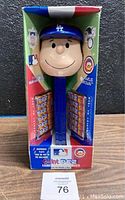 Front view of the boxed Charlie Brown Dodgers giant PEZ dispenser with candy rolls visible inside the packaging.