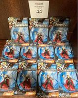 Photo showing eleven Marvel Avengers Thor figures, mint on card with blue Avengers background packaging.