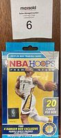 Front view of sealed 2019-2020 NBA Hoops Premium Stock trading card box, showing player Zion Williamson and branding details.