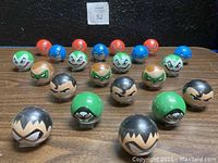 22 DC character figures arranged in 4 rows showing varying colors and characters.