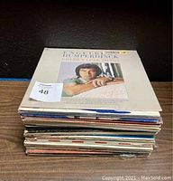 Stack of various vintage record albums with an Engelbert Humperdinck cover visible on top.
