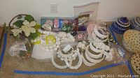 Overview of bridal party headbands and floral accessories on carpet with packing material visible