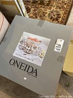 Box labeled ONEIDA with image of the punch bowl set on the top.