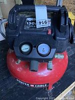 Front and top view of the Porter-Cable air compressor showing pressure gauges, power switch, labels with specifications and brand name.