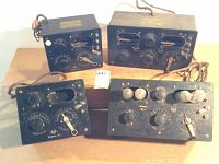 Four Radiola units on table: two Radiola III front panels at left, two larger Radiola III A panels at right