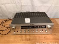 Front angled view of Sony STR-6055 stereo receiver showing overall condition and ventilation slots.