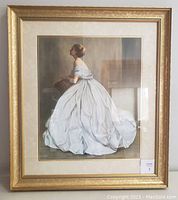 Full front view of the framed print showing the woman in a white dress seated and profile view.