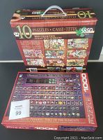 Front of large box showing 10 bird-themed puzzles with total 5850 pieces and visible handle