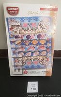 Front view of the sealed Bernat Crafts latch hook rug hooking kit with seashells design visible on the box.
