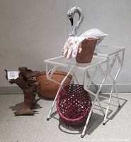 Lot setup showing all items including nesting tables, swan decor, candle holder, clay pot with gloves, wall pot, and driftwood sculpture.