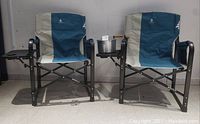 Two Woods camp chairs side-by-side with Whirley-Pop popcorn popper on right chair’s side table