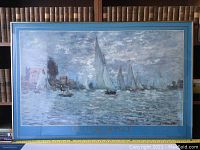 Full front view of framed print of Monet painting 'Regatta at Argenteuil'.