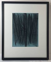 Front view of the framed lithograph showing the black abstract lines on blue background with white matting and black frame.