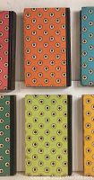 Top view of the books showing the colorful patterned covers.