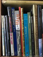 Books in box with titles visible relating to Jewish themes, Holocaust, synagogues, heritage, and art.