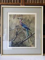 Framed print showing a Lilac Crested Roller bird perched on a branch with natural background.