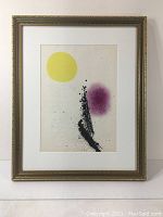 Framed lithograph full view under glass against white background