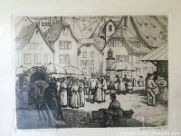 Black and white etching of a street market scene with buildings and people under umbrellas, signed in lower right corner and dated 1923.