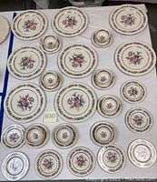 Top view of the full set showing cups, saucers, bread plates, and dinner plates arranged on a table.
