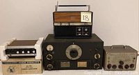 Overview of all four electronics: Realistic High Fidelity stereo amplifier, National Tube Radio, Century Mark IV shortwave radio, and Heathkit R.F. Signal Generator