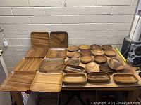 Top perspective view of the collection of wooden dishes showing various shapes and sizes.
