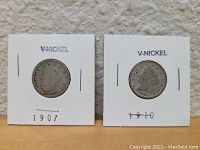 Front view of the two U.S. V Nickels in holders, showing dates 1907 and 1910.