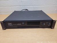 Front view showing QSC Audio branding, RMX 850 model, power switch, and dual channel volume knobs.