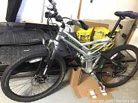 Three-quarter view of the full bike showing frame, wheels, suspension and handlebar