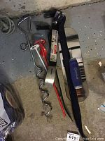 Overview of all crowbars and ground hooks laid on floor showing size and condition