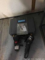 Three power tools together: impact driver, angle grinder, and palm sander, in carrying case.