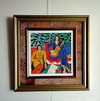 Front view of framed lithograph showing colorful artwork and gold decorative frame.