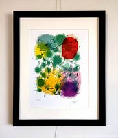 Framed Joan Miro lithograph print with colorful abstract shapes and black lines.