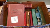 Box of 19 antique and vintage medical and veterinary books showing book spines and covers in cloth bindings of various colors including red, green, blue and beige.