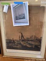 Framed maritime etching with gold frame and view of turbulent water and sailing vessels.
