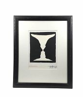 Framed lithograph showing black-and-white vase/faces illusion, matted and enclosed in black wooden frame