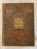Front cover of the 1912 edition book showing intricate design and title