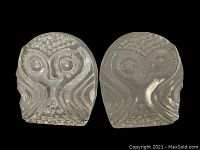 Pair of clear glass owl bookends on a black background, showing detailed owl faces and textured glass.