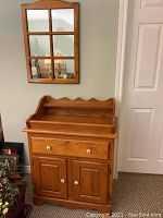Oak dry sink with drawer and double doors, showing front view and wood grain.