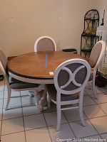 Full lot showing round table and four chairs