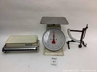 Three vintage scales together including a Soehnle flat scale, round dial kitchen scale, and narrow mechanical scale.