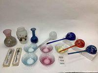 All 14 pieces arranged including vases, bowls, and plant watering bulbs showing colors and condition