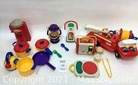 All 15 toys displayed including kitchen utensils, fire engine, toaster, gas pump, silo, lantern and utensils.