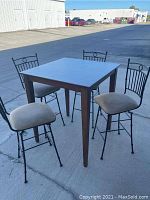 Full view of high top pub table and four barstools showing materials, finish, and general condition