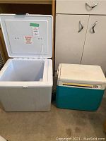Photo showing the Koolatron electric cooler (open) and Coleman cooler side by side.
